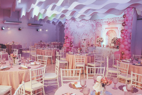 Elegant wedding event venue with floral ceiling